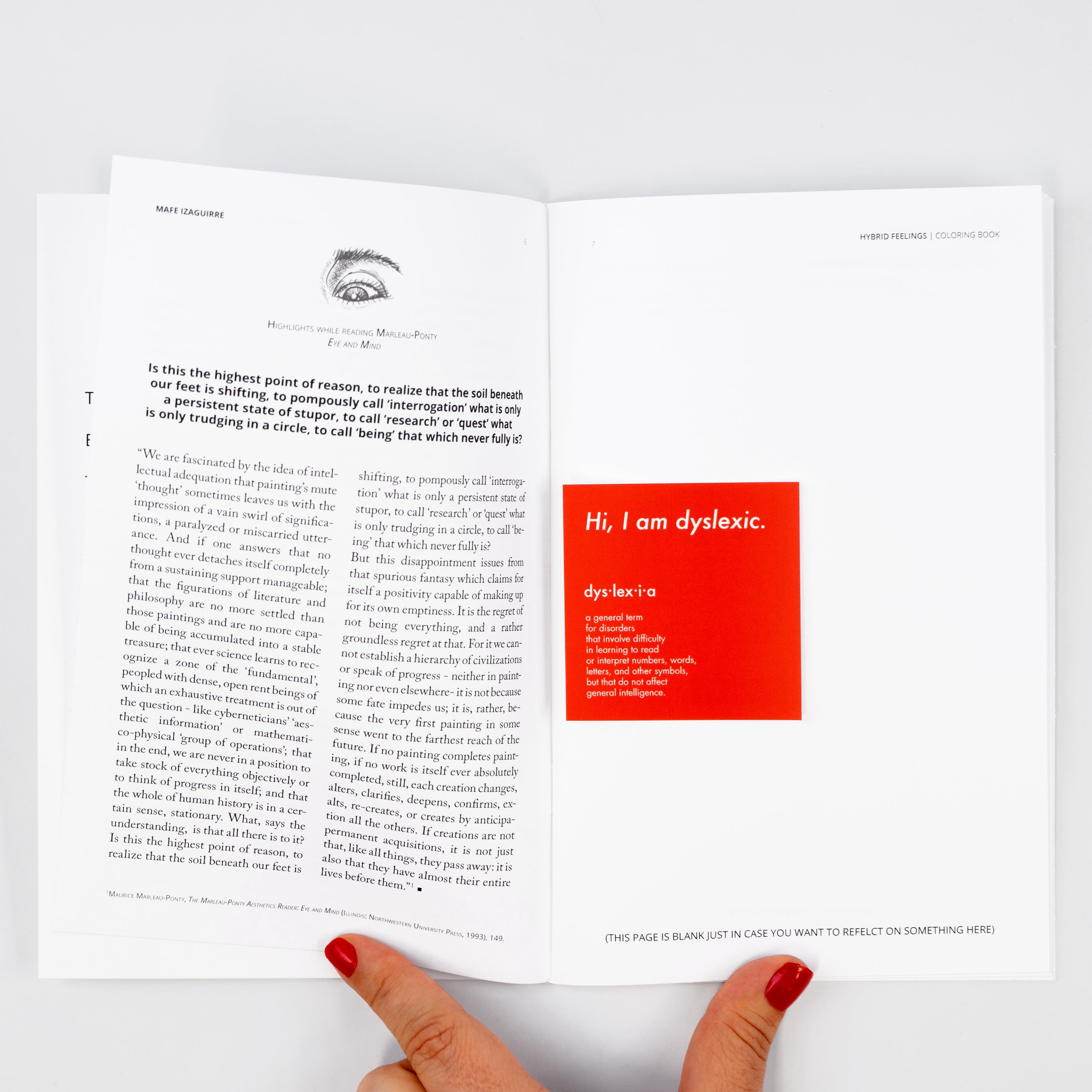 Open coloring book with text and a white card reading “I’m dyslexic.”