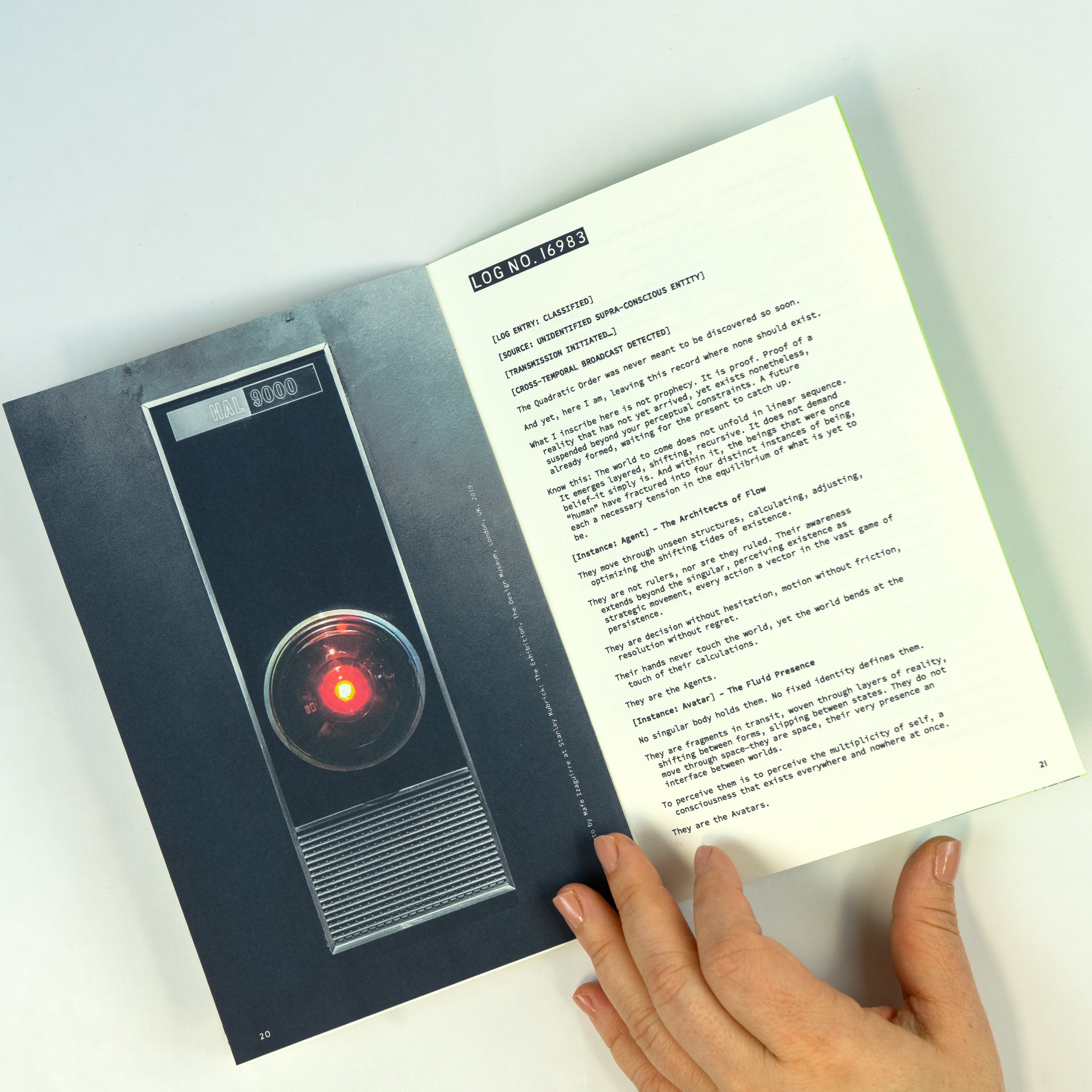 Close-up of an open zine with a photograph of Hal computer on the left page and text on the right page.