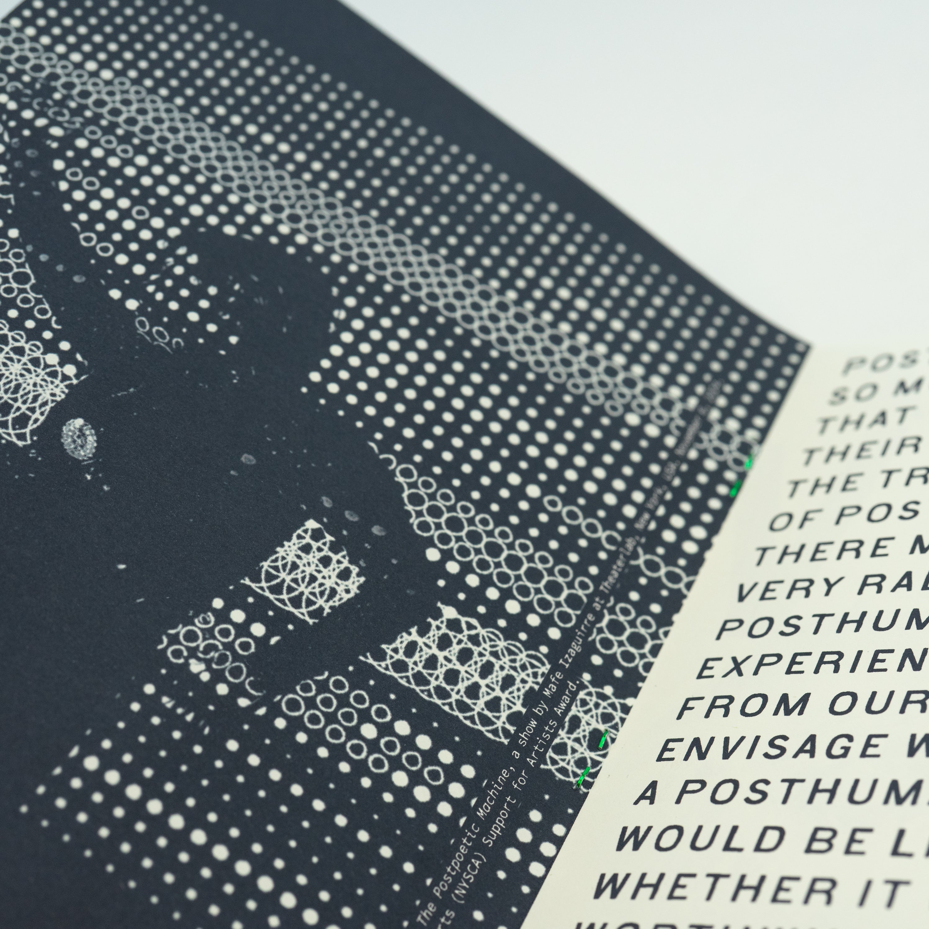 Close-up of an open zine with a photograph on the left page and text on the right page.