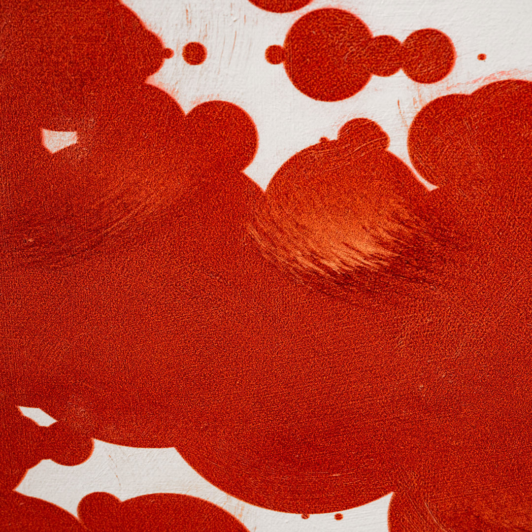 Close-up of red canvas with white patterns