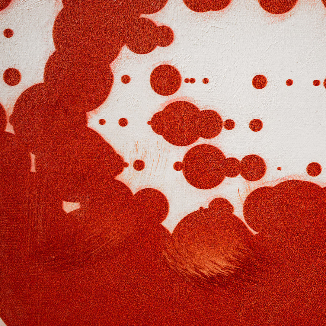 Abstract art with red and white circles on a textured background
